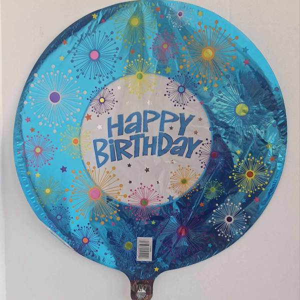 Round blue birthday balloon with colorful starburst patterns