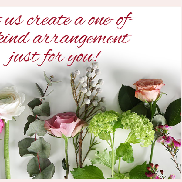 Assorted roses and greenery arranged beneath red script text.