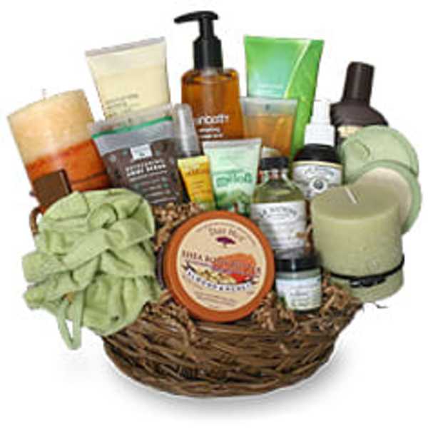 Spa gift basket with candles and bath products in a wicker basket