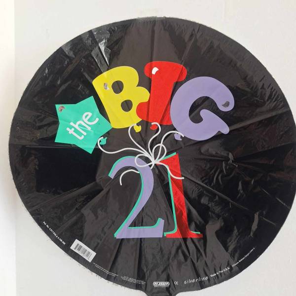 Black round balloon with colorful "the BIG 21" text