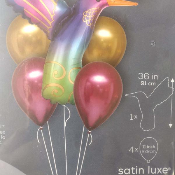 Hummingbird-shaped foil balloon with four round balloons