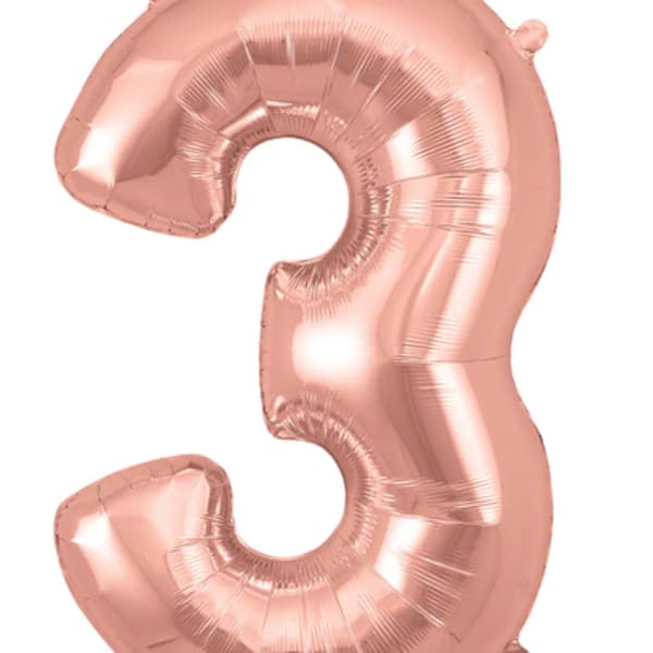 Rose gold foil balloon shaped like the number 3