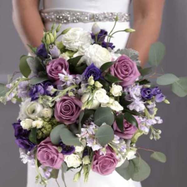 Bridal bouquet of pink, white, and purple flowers