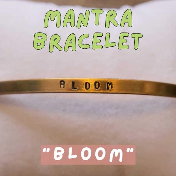 Gold bracelet engraved with the word Bloom