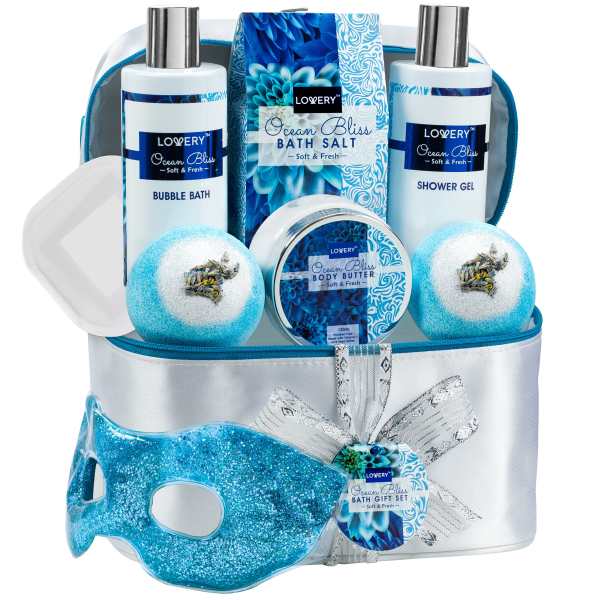 Ocean-themed blue and white bath gift set with bottles, bath bombs, and a glittery mask in a cosmetic bag
