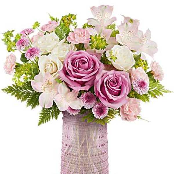 Pink and white bouquet in a textured pink vase
