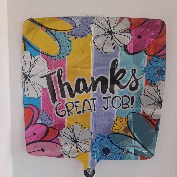 Colorful balloon with "Thanks Great Job!" text and floral graphics