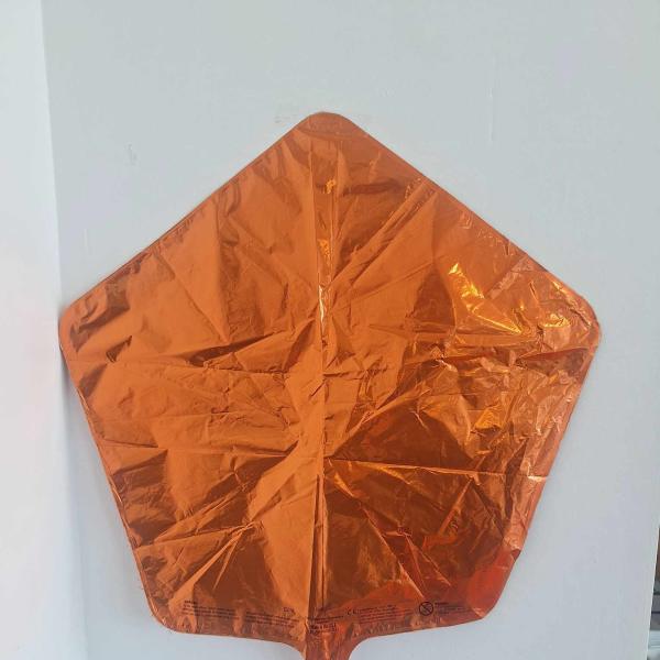 Orange metallic foil balloon shaped like a leaf or kite