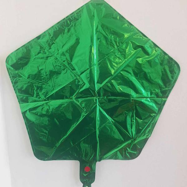 Green foil balloon shaped like a Christmas tree