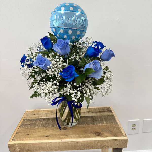 Blue rose bouquet with a "It's a Boy!" balloon in a glass vase