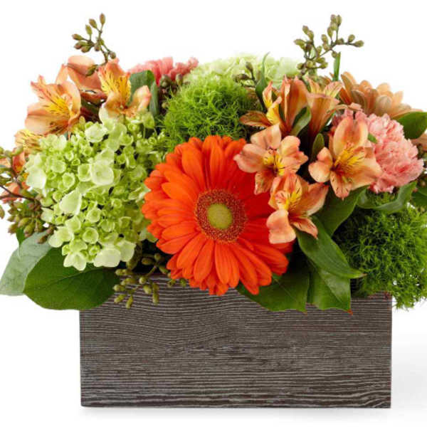 Mixed bouquet in a rectangular wooden box with orange and peach flowers