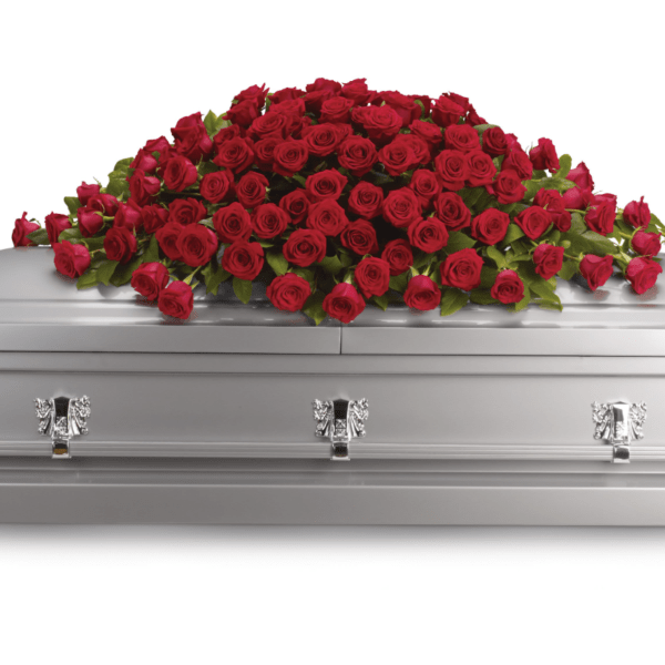 Red roses arranged on a silver casket