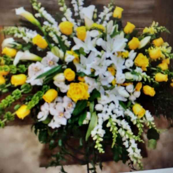 Large white and yellow floral spray with lilies and roses