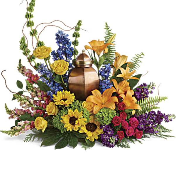 Colorful funeral spray with an urn centerpiece and mixed flowers