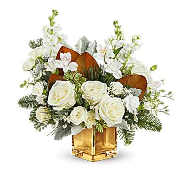 White rose arrangement in a gold vase with white orchids and greenery