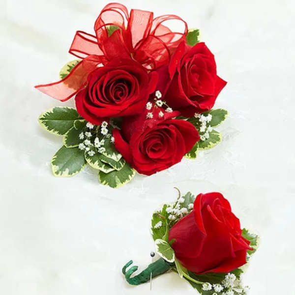 Red rose corsage and boutonniere with ribbon accents