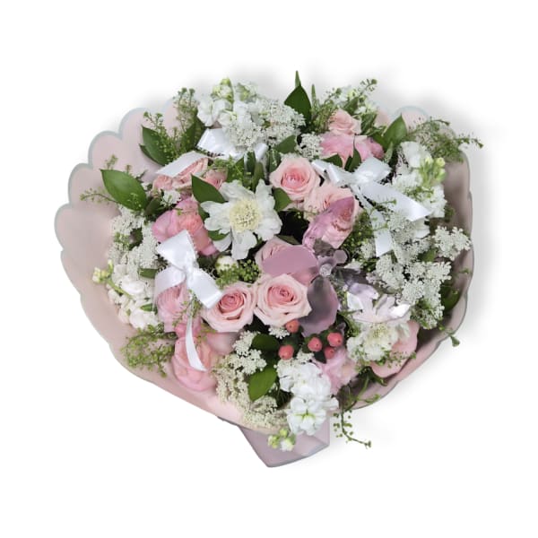 Pink and white rose bouquet with white filler flowers and ribbon accents