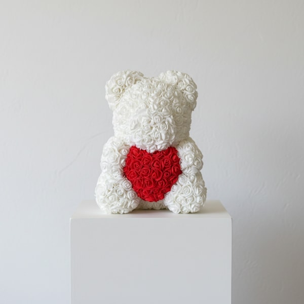 White rose teddy bear with a red heart on its chest