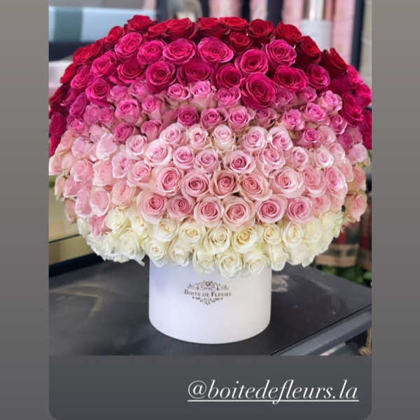 Large ombré bouquet of pink and red roses in a white hat box