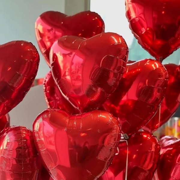 Cluster of red heart-shaped balloons