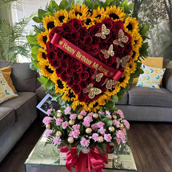 Heart-shaped rose and sunflower arrangement with a birthday ribbon