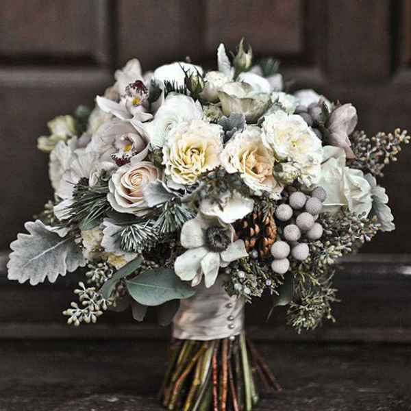 White and cream bridal bouquet with roses and orchids