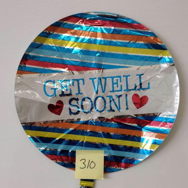 Round foil balloon with "Get Well Soon!" text and hearts