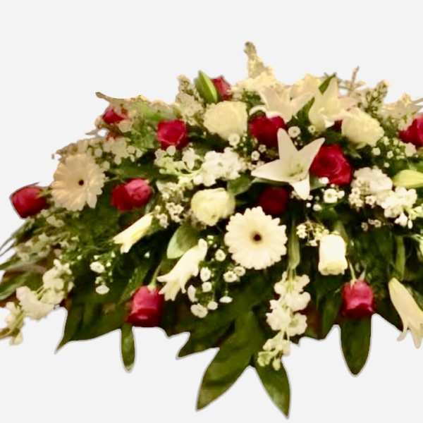 Casket spray with red and white flowers