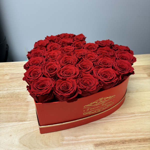 Heart-shaped box filled with red roses