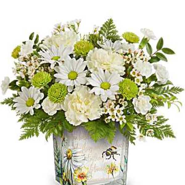 White daisies and green pom flowers in a painted glass vase