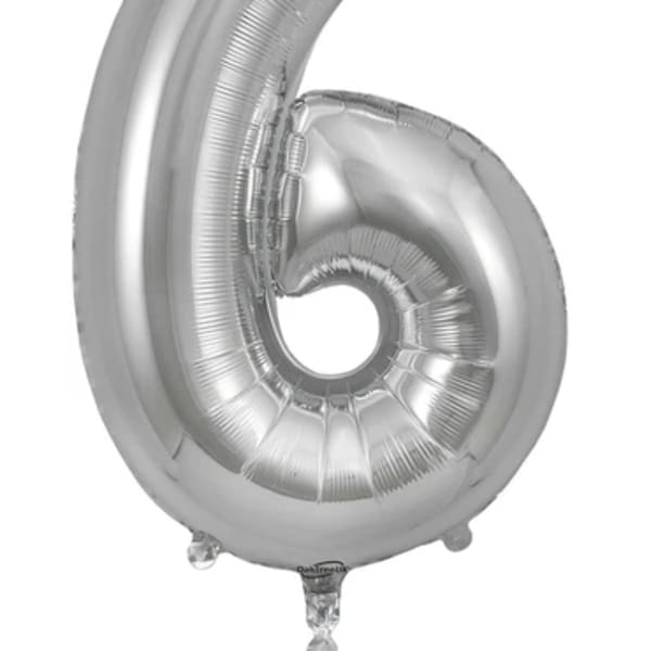Silver foil balloon shaped like the number 6