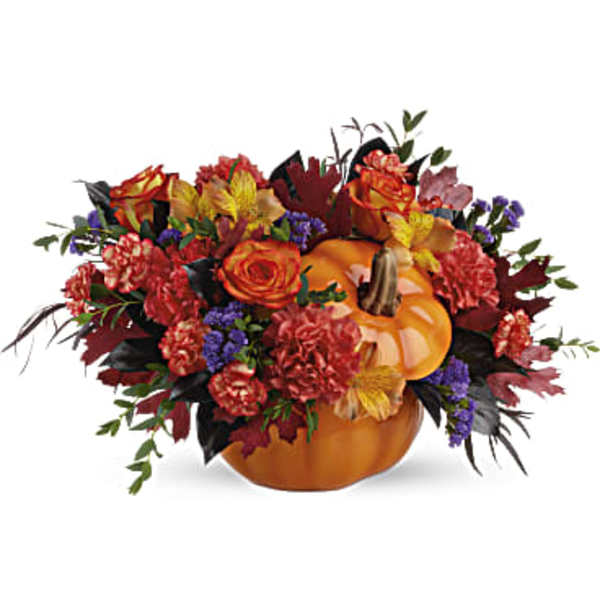Pumpkin-shaped floral arrangement with orange and red flowers