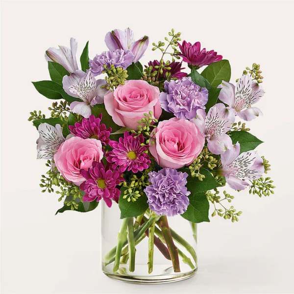 Pink and lavender bouquet in a clear glass vase