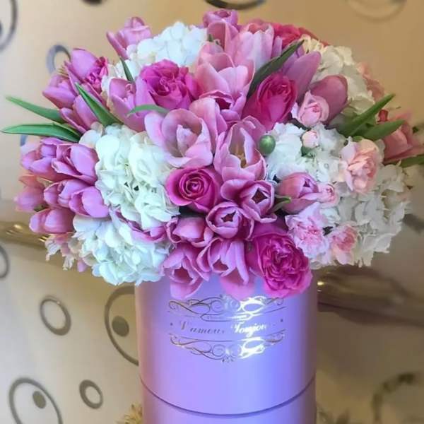 Pink and white bouquet in a lavender hat box