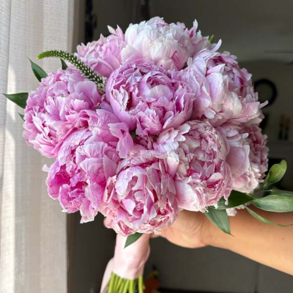 Pink peony bouquet with a pale pink ribbon wrap