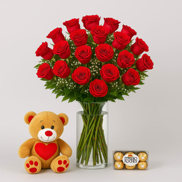 Red roses in a glass vase with a teddy bear and chocolates