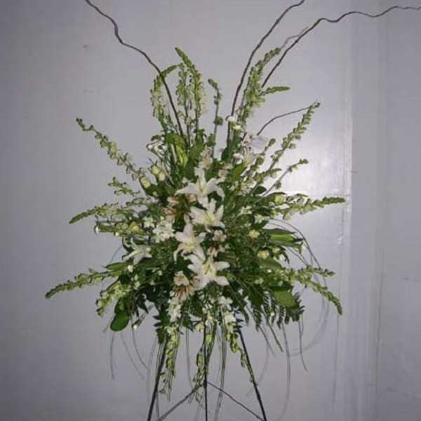 Tall white floral standing spray with long arching stems