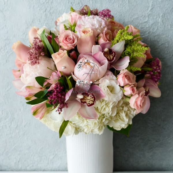 Pink and white mixed bouquet in a white vase
