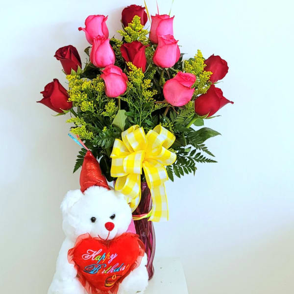 Birthday balloon bouquet with roses and a teddy bear in a vase