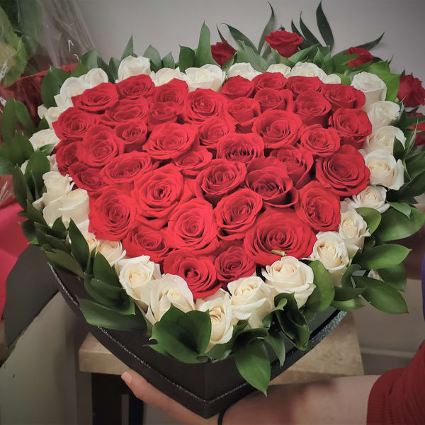 Heart-shaped box of red and white roses