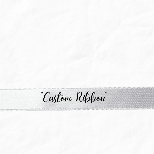 White ribbon with the words "Custom Ribbon" printed on it