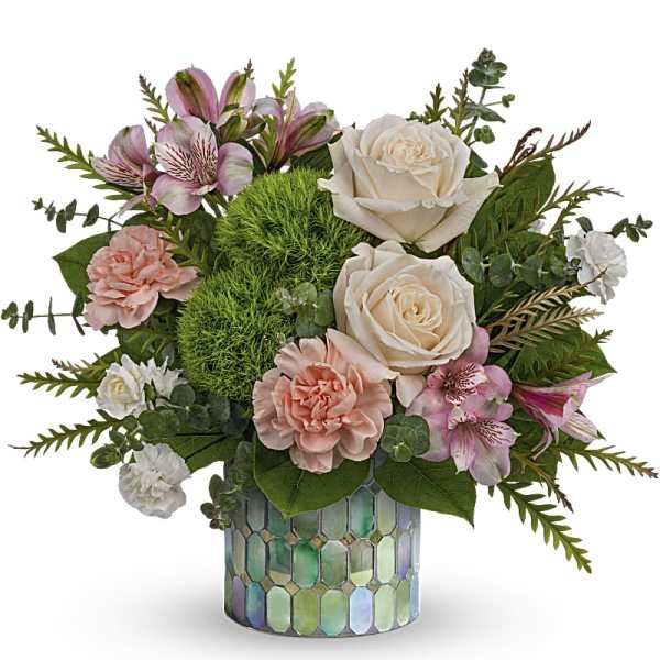 Pink and white floral arrangement in a mosaic glass vase