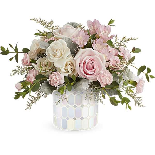 Pink and white rose arrangement in a mosaic ceramic vase