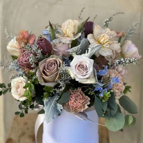 Mixed pastel bouquet in a white round box