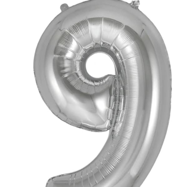Silver foil balloon shaped like the number 9
