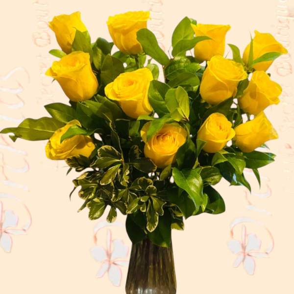 Yellow roses arranged in a dark glass vase