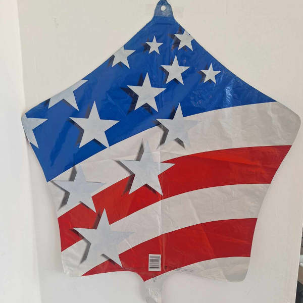 Star-shaped patriotic foil balloon with red, white, and blue stripes