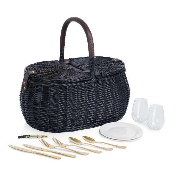 Black wicker picnic basket with plates, glasses, and gold utensils