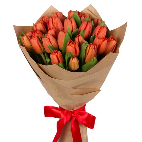 Bouquet of orange tulips wrapped in brown paper with a red ribbon