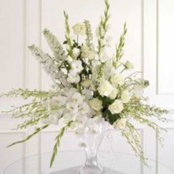 White floral arrangement in a clear glass vase